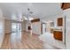 Expansive living space with hardwood floors connecting the living room, kitchen, and sunroom at 729 Scottsdale St, Henderson, NV 89002