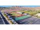 Aerial view of school sports fields including track, tennis courts, and baseball field at 729 Scottsdale St, Henderson, NV 89002