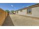 Backyard featuring gravel landscaping, block wall and artificial grass for easy maintenance at 7418 Lawrence Powers Ct, Las Vegas, NV 89129