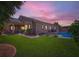A tranquil backyard oasis featuring a covered patio and a refreshing swimming pool at 7418 Lawrence Powers Ct, Las Vegas, NV 89129