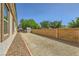 Large backyard space with gravel groundcover and block wall providing privacy and low-maintenance living at 7418 Lawrence Powers Ct, Las Vegas, NV 89129