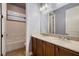 This bathroom has a double vanity, two sinks, framed mirrors, and a shower-tub combo at 7418 Lawrence Powers Ct, Las Vegas, NV 89129