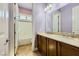 Spacious bathroom with double vanity, granite countertops, and tiled flooring at 7418 Lawrence Powers Ct, Las Vegas, NV 89129
