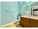 Well-maintained bathroom with a single vanity, neutral color palette, and tiled flooring at 7418 Lawrence Powers Ct, Las Vegas, NV 89129