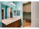 Bathroom vanity featuring granite countertop, and an open walk-in closet at 7418 Lawrence Powers Ct, Las Vegas, NV 89129