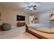 Spacious bedroom featuring ceiling fan and sliding door closet at 7418 Lawrence Powers Ct, Las Vegas, NV 89129