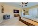 Bedroom with cozy carpet and a TV at 7418 Lawrence Powers Ct, Las Vegas, NV 89129