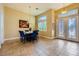 Dining area with stylish lighting, seating for six, and an adjacent foyer at 7418 Lawrence Powers Ct, Las Vegas, NV 89129