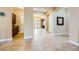 Spacious entryway showcases tile flooring, arched openings, and access to other rooms at 7418 Lawrence Powers Ct, Las Vegas, NV 89129