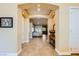 Charming entryway with tile flooring, arched doorways, and views of the living room at 7418 Lawrence Powers Ct, Las Vegas, NV 89129