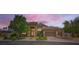 Beautiful single-story home featuring a three-car garage, manicured landscaping, and a welcoming stone facade at 7418 Lawrence Powers Ct, Las Vegas, NV 89129