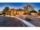 Charming single-Gathering home with illuminated landscape lighting and a three-car garage at 7418 Lawrence Powers Ct, Las Vegas, NV 89129