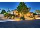 Charming single-Gathering home with illuminated landscape lighting and a three-car garage at 7418 Lawrence Powers Ct, Las Vegas, NV 89129