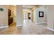 Spacious foyer with tile flooring, archway, and detailed millwork at 7418 Lawrence Powers Ct, Las Vegas, NV 89129