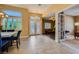 Spacious foyer featuring tile flooring, decorative doors, and ample natural light at 7418 Lawrence Powers Ct, Las Vegas, NV 89129