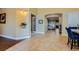 Bright open foyer with tile floors, arched doorways, and view to formal dining area at 7418 Lawrence Powers Ct, Las Vegas, NV 89129