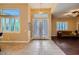 Welcoming foyer with tile flooring, decorative glass doors, and ample natural light with views of living room at 7418 Lawrence Powers Ct, Las Vegas, NV 89129