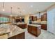 Expansive kitchen with granite countertops, stainless appliances, center island, and ample cabinet space at 7418 Lawrence Powers Ct, Las Vegas, NV 89129