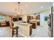 Open kitchen with granite countertops, stainless steel appliances, and tile flooring at 7418 Lawrence Powers Ct, Las Vegas, NV 89129