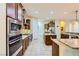 Gourmet kitchen featuring stainless steel appliances, granite countertops, and custom cabinetry at 7418 Lawrence Powers Ct, Las Vegas, NV 89129