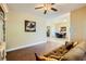 Comfortable living room with hardwood floors, neutral paint, and access to dining area at 7418 Lawrence Powers Ct, Las Vegas, NV 89129
