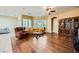 Living room boasts hardwood floors, plantation shutters, and an antique cabinet at 7418 Lawrence Powers Ct, Las Vegas, NV 89129