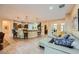 Inviting living room connected to the kitchen with comfortable seating and stylish decor at 7418 Lawrence Powers Ct, Las Vegas, NV 89129