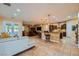 Spacious living room with an open floor plan connected to the kitchen and access to the backyard at 7418 Lawrence Powers Ct, Las Vegas, NV 89129