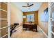 Cozy home office with a large desk, neutral carpet, and natural light at 7418 Lawrence Powers Ct, Las Vegas, NV 89129