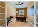 Home office featuring carpet, a ceiling fan, natural light from a window, and a desk with office equipment at 7418 Lawrence Powers Ct, Las Vegas, NV 89129