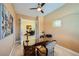 Home office with french doors, a desk, and views into the formal dining room at 7418 Lawrence Powers Ct, Las Vegas, NV 89129