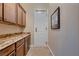 Walk-in pantry featuring granite countertops and ample cabinet storage space at 7418 Lawrence Powers Ct, Las Vegas, NV 89129