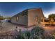 Exterior shot showcasing a neatly landscaped side yard with plants, gravel, and charming pathway lighting at 7418 Lawrence Powers Ct, Las Vegas, NV 89129