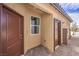 Exterior showcasing two entry doors, a window, and appealing architectural details at 7705 Serenity Bay Ln # Lot 57, North Las Vegas, NV 89084