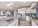 Well-appointed kitchen features modern appliances, a center island, and granite countertops, perfect for culinary enthusiasts at 7705 Serenity Bay Ln # Lot 57, North Las Vegas, NV 89084
