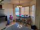 The dining area features natural lighting from the two windows and a view from the kitchen at 809 Rock Springs Dr # 202, Las Vegas, NV 89128