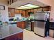Modern kitchen with stainless steel appliances, granite counters, and plentiful cabinets at 809 Rock Springs Dr # 202, Las Vegas, NV 89128