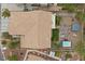 Aerial rooftop view of backyard oasis featuring a hot tub, gazebo, fire pit and desert landscaping at 8208 Fritzen Ave, Las Vegas, NV 89131