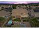 Aerial view of a home showcasing the backyard, patio, fire pit, hot tub, gazebo, and landscaping at 8208 Fritzen Ave, Las Vegas, NV 89131