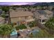 An aerial view showcases a beautifully landscaped backyard with pool and patio at 8208 Fritzen Ave, Las Vegas, NV 89131
