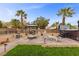 Lovely backyard featuring a gazebo, patio, hot tub, fire pit and lush green lawn at 8208 Fritzen Ave, Las Vegas, NV 89131