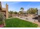 Beautiful backyard with a well-maintained lawn, patio, gazebo, and hot tub at 8208 Fritzen Ave, Las Vegas, NV 89131