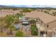 Backyard oasis featuring a pool, hot tub, outdoor seating, desert landscaping, and mature palm trees at 8208 Fritzen Ave, Las Vegas, NV 89131