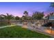 Inviting backyard featuring a gazebo, hot tub, fire pit and ambient lighting at 8208 Fritzen Ave, Las Vegas, NV 89131