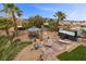 Spacious backyard oasis boasting a gazebo, hot tub, fire pit and manicured landscaping at 8208 Fritzen Ave, Las Vegas, NV 89131