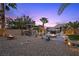 Relaxing backyard offering a gazebo, fire pit, hot tub and desert landscape at 8208 Fritzen Ave, Las Vegas, NV 89131