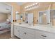 Bright bathroom featuring a long vanity, lots of storage, and an attached shower with a bathtub at 8208 Fritzen Ave, Las Vegas, NV 89131