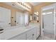 Bright bathroom featuring a long vanity, lots of storage, and an attached shower with a bathtub at 8208 Fritzen Ave, Las Vegas, NV 89131