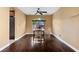 Hardwood flooring, natural lighting, and a ceiling fan enhance the dining space at 8208 Fritzen Ave, Las Vegas, NV 89131