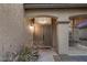 Covered front porch with double doors, decorative columns, and desert landscaping for curb appeal at 8208 Fritzen Ave, Las Vegas, NV 89131